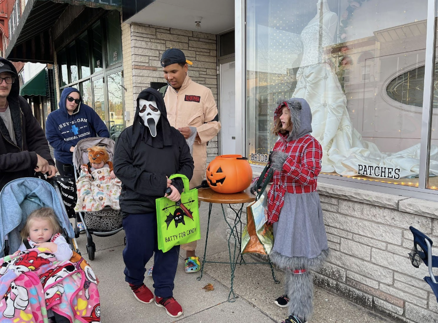 Trick-or-treaters dressed in their costumes gather in front of Heather’s Tailoring & Custom Sewing as they participate in Whitewater’s Ghouls Night Out. 
