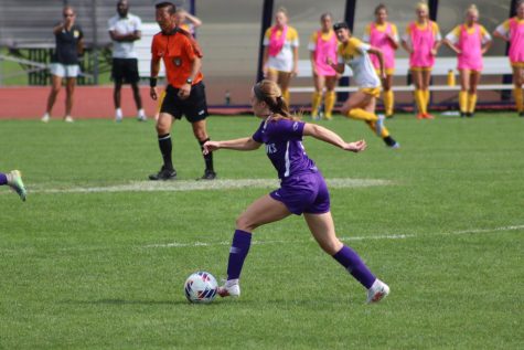 Prigge gets the soccer ball and moves down the field.