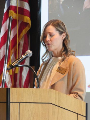 Amy Moore, Veterans Benefits Coordinator, shares a poem about the daily life of veterans returning home from the service as well as the struggles of adapting to civilian lifestyles during the Veteran’s Day Assembly held in the UC Old Ballroom on Nov. 11, 2022.  
