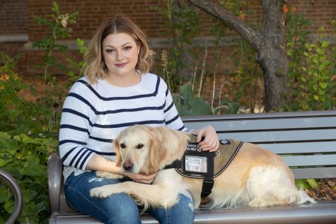 Randi Miranda, a U.S. Navy veteran and senior dietetics major, shown with her service dog, Abbey, will take part in a Veterans Day ceremony on Nov. 11 at UWSP.