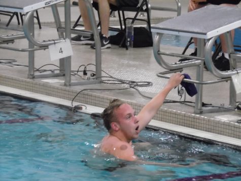 Hunter Hayberger celebrates as he completes the “Mens 100 Yard Freestyle,” for the meet versus UW-Oshkosh, at the Williams Center.
