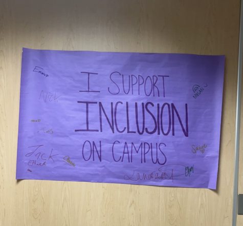 Wells dormitory resident assistants emphasize their support for inclusion at the University of Wisconsin-Whitewater with a poster in the main hallway (photo taken by Rori Leonhard).