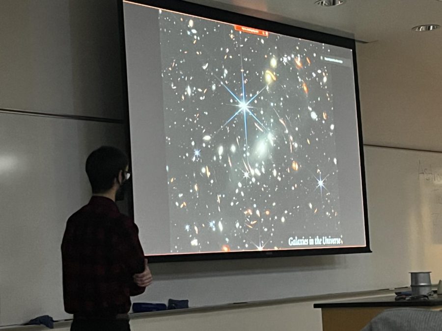 Professor+Michael+Maseda+of+the+University+of+Wisconsin-Madison%2C+explaining+how+the+telescope+takes+photos+of+galaxies+that+have+never+been+visible+on+telescope+cameras+before.+%0A