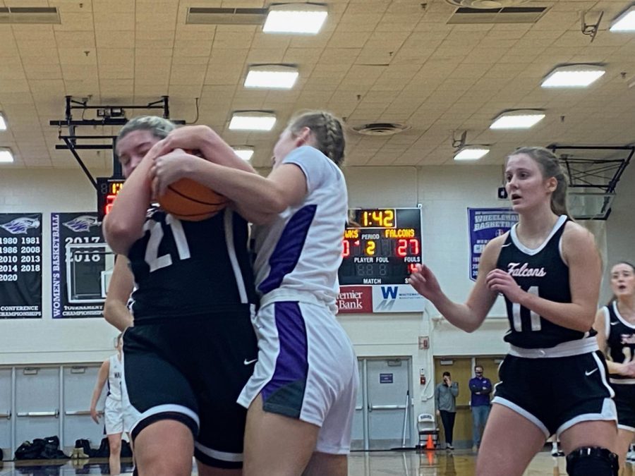 Aleah+Grundahl+fights+for+a+loose+ball+on+the+Warhawks+home+court