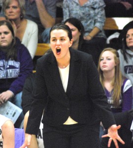 Head Coach Keri Carollo offers encouragement to her team during a game in the 2013 season at Kachel Gymnasium 
