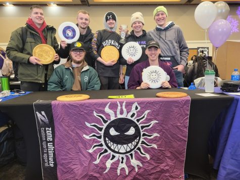 The frisbee club stands proudly behind their booth at the Spring Involvement fair. Feb. 1
