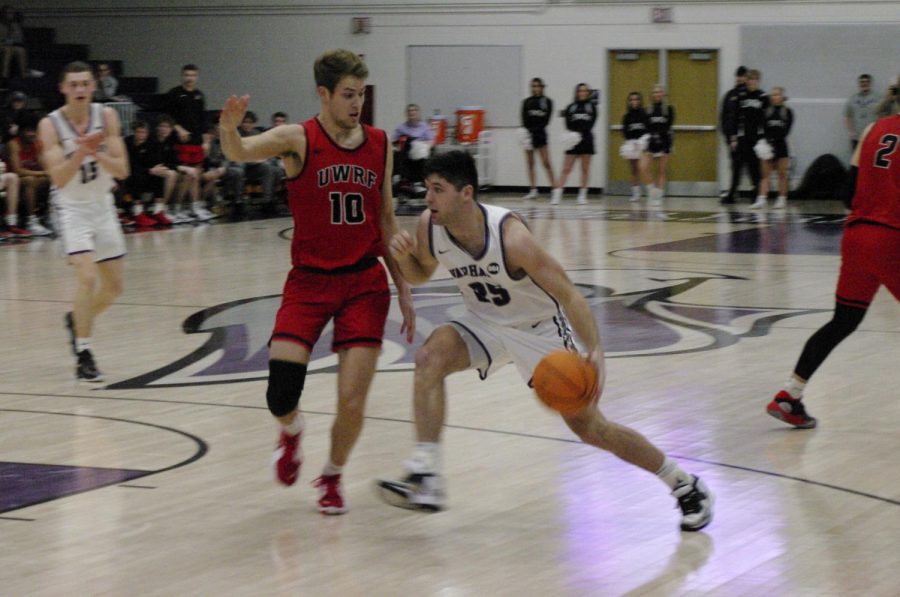 #25 Drew Fisher drives to the basket in a game against UW-River Falls in the Kachel Fieldhouse on Feb. 20.

