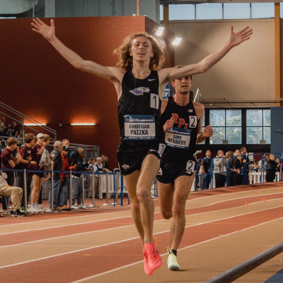 Sophomore+runner+Christian+Patzka+raises+his+arms+in+celebration+as+he+completes+a+race+at+the+NCAA+Division+IIl+Track+%26+Field+Indoor+Championships+in+Birmingham%2C+Alabama%2C+March+10+and+11.%0A