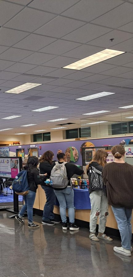 UW-Whitewater students pick out paint colors for their paintings at the Paint N Sip in the University Center in the Warhawk Connection Center Mar. 21 2023.