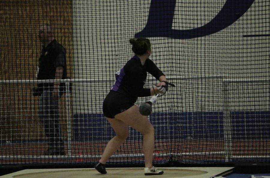 Czarnecki competing in the hammer throw at the WIAC indoor conference meet.
