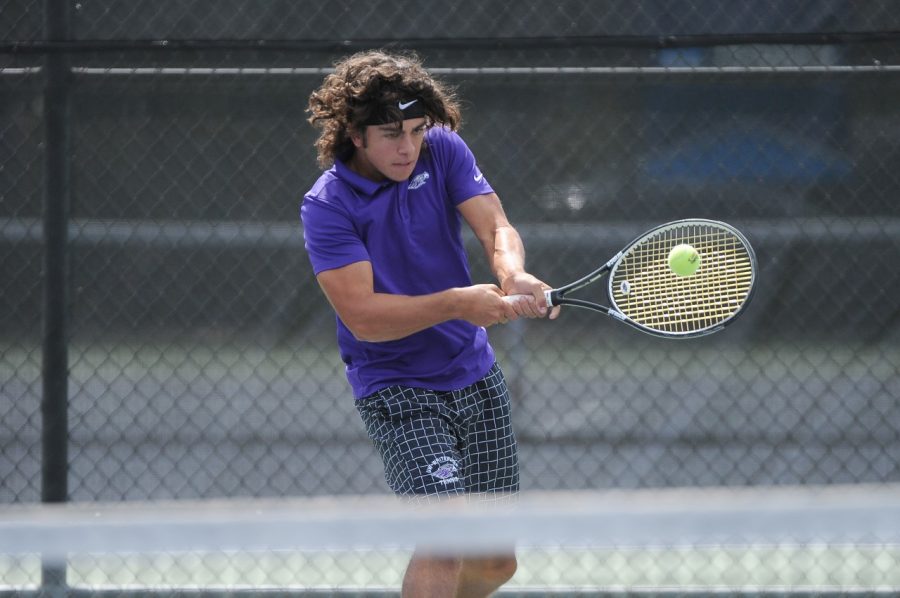 Cole Lindwall hits a backhand in a match.

