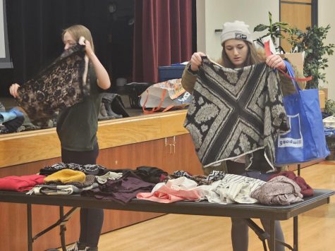 Criminology major Alissa LoCicero-Geraths searches through a table full of dresses and t-shirts for that next perfect fit. Apr. 18 2023
