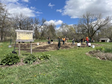 Photo taken of the opening day of the community garden, student volunteers and the sustainability office student workers work hard to prepare the garden for planting. (Libby Nabhan)