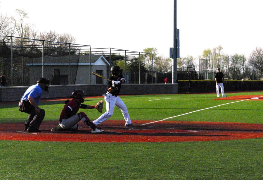 #12 Jacob DeMeyer swings at a pitch against Edgewood College at Prucha Field at Jim Miller Stadium on Thursday April 27th