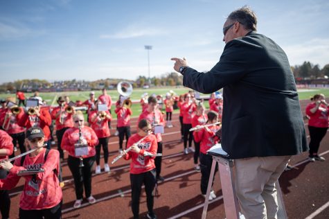 Tom Barnett, UW-River Falls marching band director, leads the UWRF pep band at Smith Stadium at Ramer Field in October 2022 prior to the start of a home game against UW-Eau Claire. 

