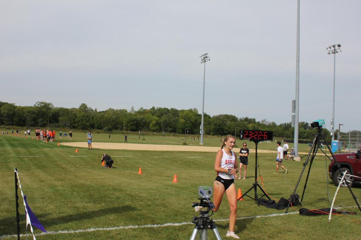 1st Place Winner Ally Werbauwhede Crossing The Finish Line Winning The Race.