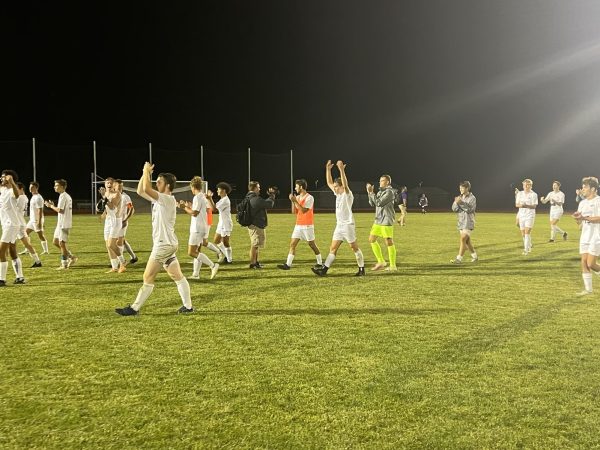 The Warhawks celebrate in front of their fans in attendance on what was a wet night at Fiskum Field in Whitewater.