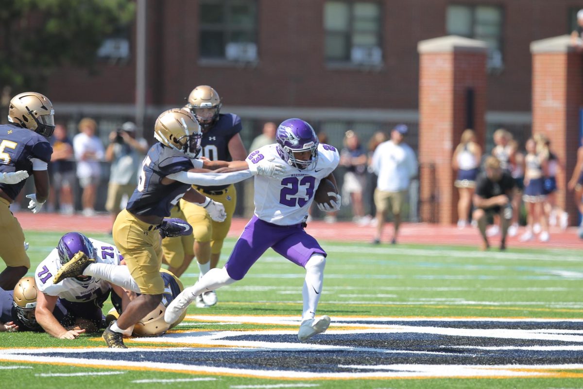 Alijah Maher-Parr sheds a defender in a 27-23 win over John Carroll University.