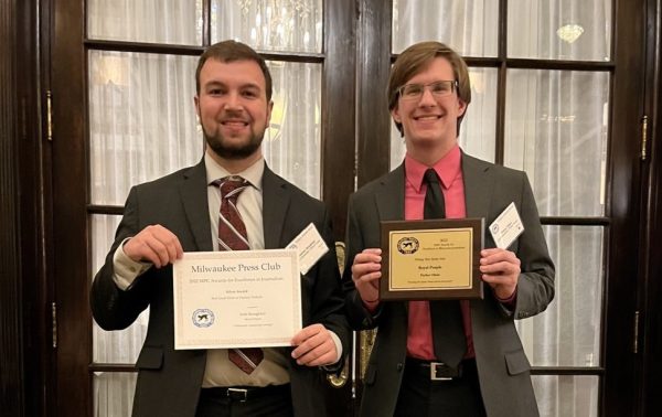 Josh Stoughton (left) and Parker Olsen  post for a celebratory photo after the Milwaukee Press Club Gridiron Awards dinner in the Pfister Hotel May 12, 2023.