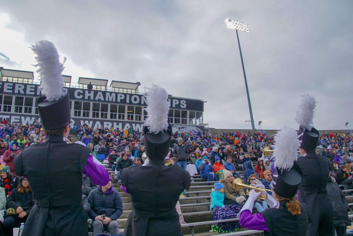 UW-W Warhawks trumpet section head up into the stands to play ‘The Warhawk Strut’ 