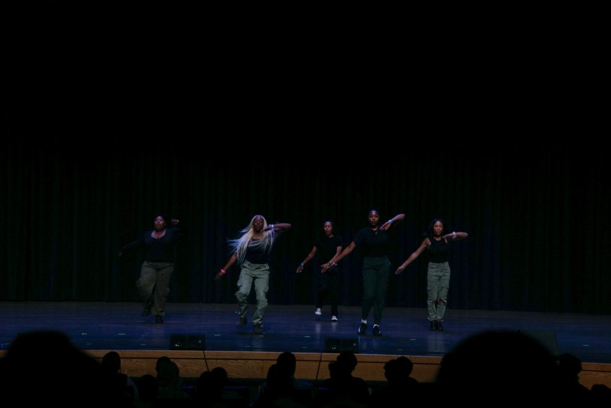Chi Sigma Tau National Fraternity performs at the talent show
