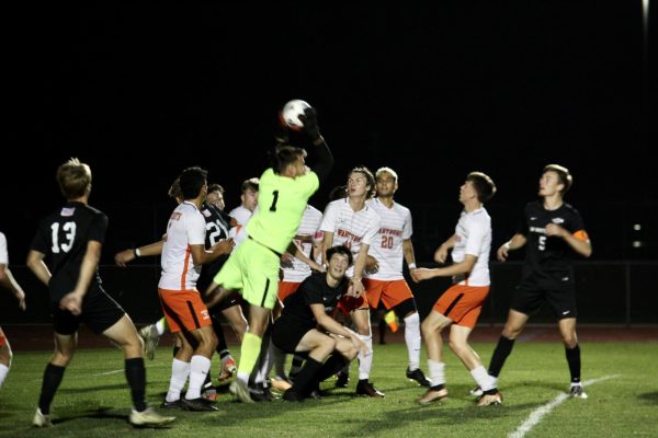 Wartburg goalkeeper Brennon Woody (#1) catches a corner kick in the second period.