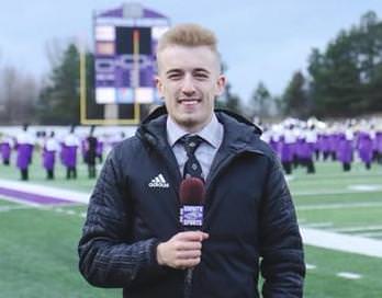 Drew Best is bundled up as a sideline reporter for a cold-weather Warhawk football game at Perkins Stadium.