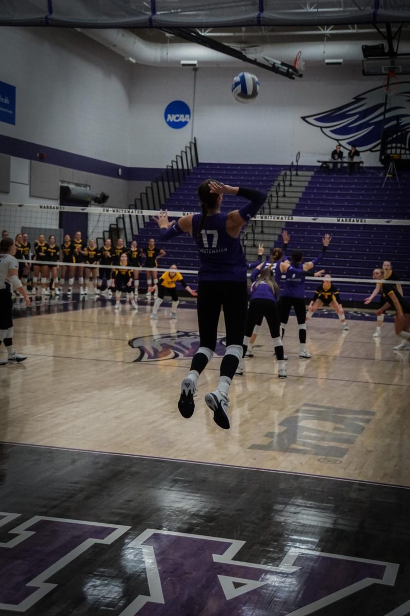 UW-Whitewaters number 17, Jenna Weinfurt hits the ball over the net