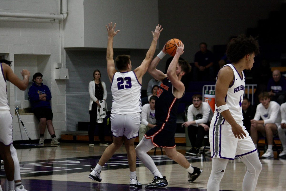 #23, Carter Capstran, defends the offensively strong Pioneers on Wednesday night, helping lead the Warhawks to a victory