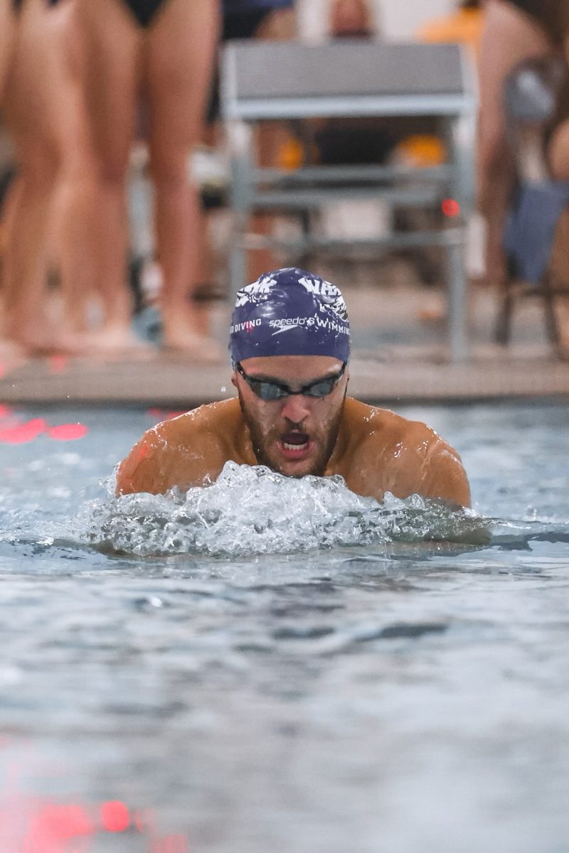 Sophomore Daniel Keller swims the 100 breaststroke at a dual meet against Illinois Institute of Technology.