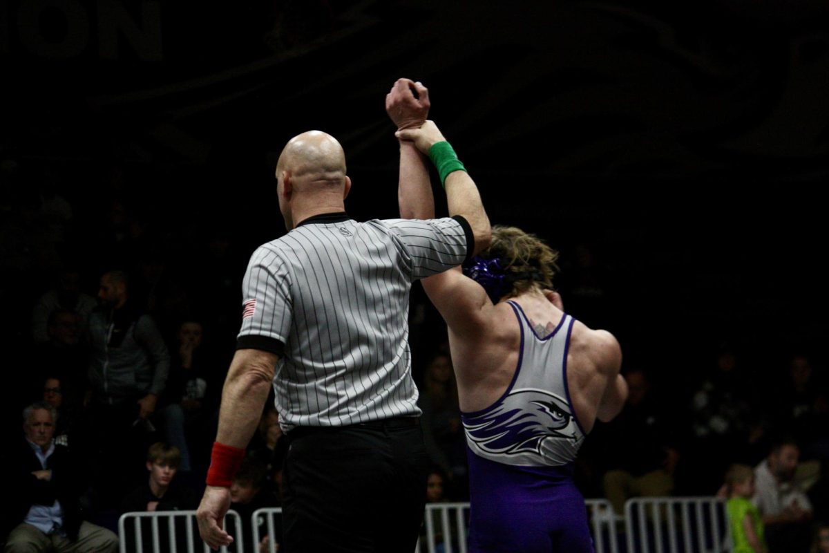 Sophomore+Dominik+Mallinder+announced+as+the+winner+of+the+133-pound+match.