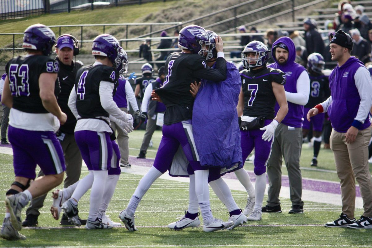 Ogden+and+Warhawk+offense+celebrate+a+touchdown+against+Wheaton+College