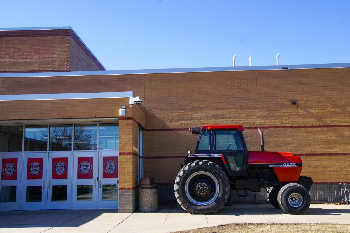 A+tractor+parked+outside+Whitewater+High+School+to+promote+the+FFA+Toy+Show.