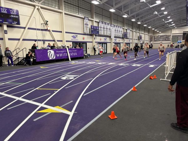 Myles Anderson surges at the end to claim victory in the 60-meter dash.