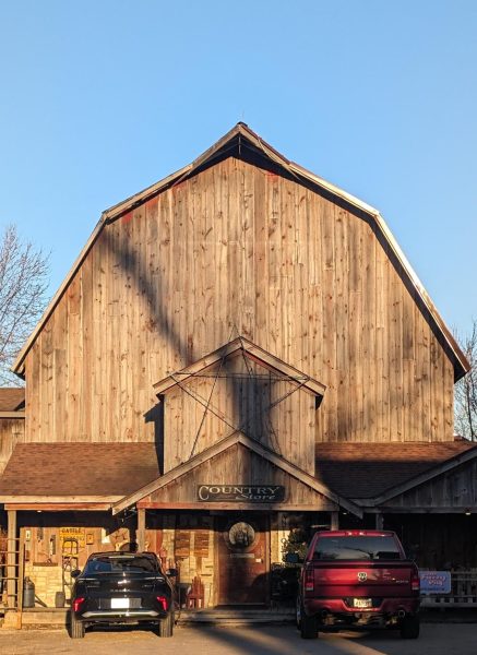 The Fuzzy Pig is inside this old barn which stands shining bright in the setting sun.