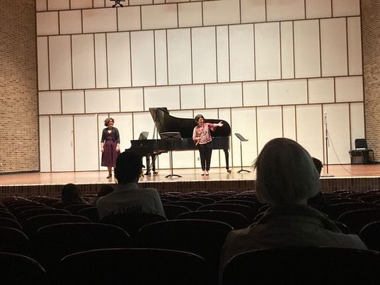 Dr. Shapiro (left) played piano for the show, while Dr. Ballatori (right) was one of the flutists. Here, they are taking a bow after finishing the last piece of the concert.

