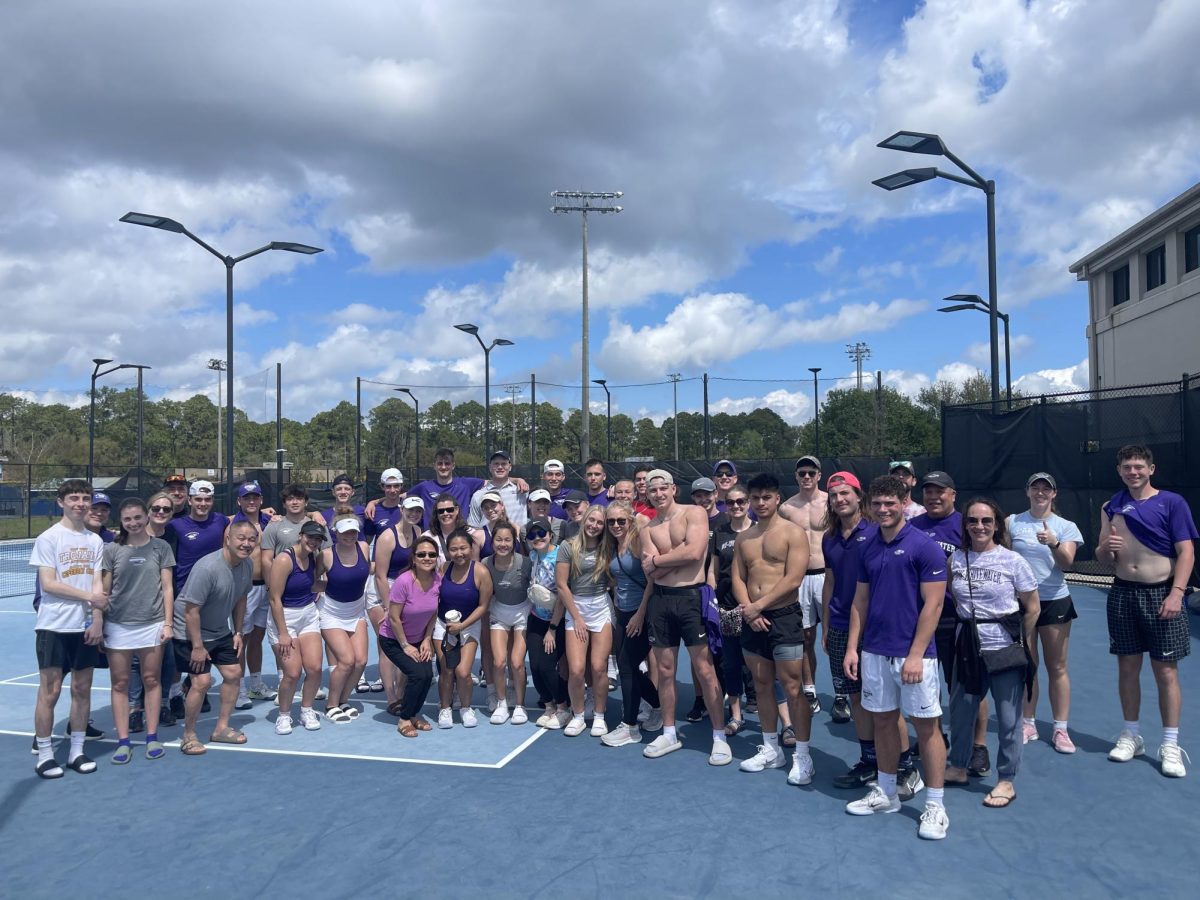 UW-Whitewater’s men’s and women’s tennis team and families posing for a group picture after their scrimmage against Carleton College in Hilton Head Island, South Carolina. 