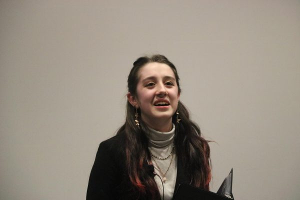 Freshman Juniper Oldenburg-Garcia performing her “Program of Oral Interpretation” speech