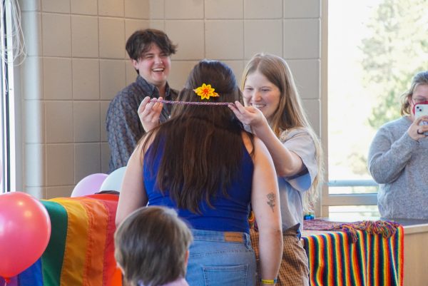 Sawyer Red (left) and Megan Kaiser (right) give Montana their rainbow cord for graduation at the Rainbow Celebration of Excellence, April 25, 2024.