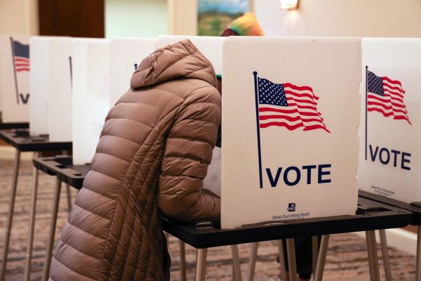 Only election officials could perform election-related tasks under a constitutional amendment up for a vote Tuesday. Election officials are questioning whether that applies to private companies that print ballots or service voting equipment