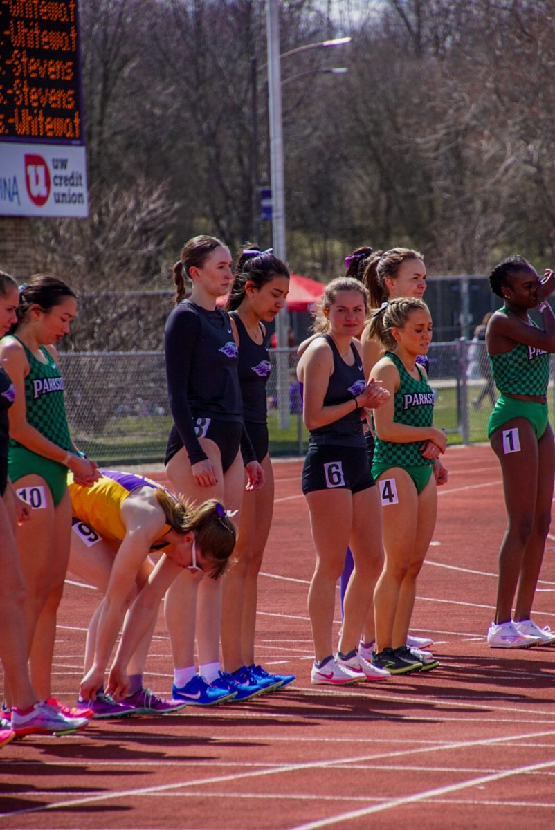 Abbey Wedick, Jocelyn Ali and Kristan Larson line up to get ready for their 1500 meter run.