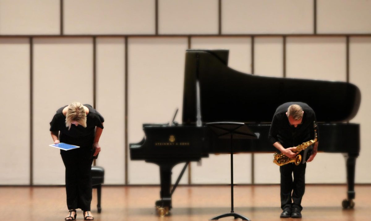 Drew Whiting (UW-Oshkosh, saxophone) and Kirsten Ihde (UW-Oshkosh, piano) bowing before performing Cadenza (1974) by Lucie Robert at the Sonict Music Program in Light Recital Hall on Tuesday, Sept. 10, 2024.