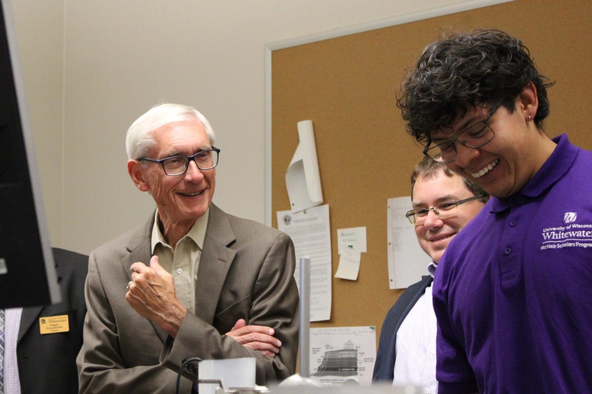 Wisconsin Governor Tony Evers visits a research lab inside Upham Hall at UW-Whitewater and converses with student researchers Wednesday, Sept. 18, 2024.