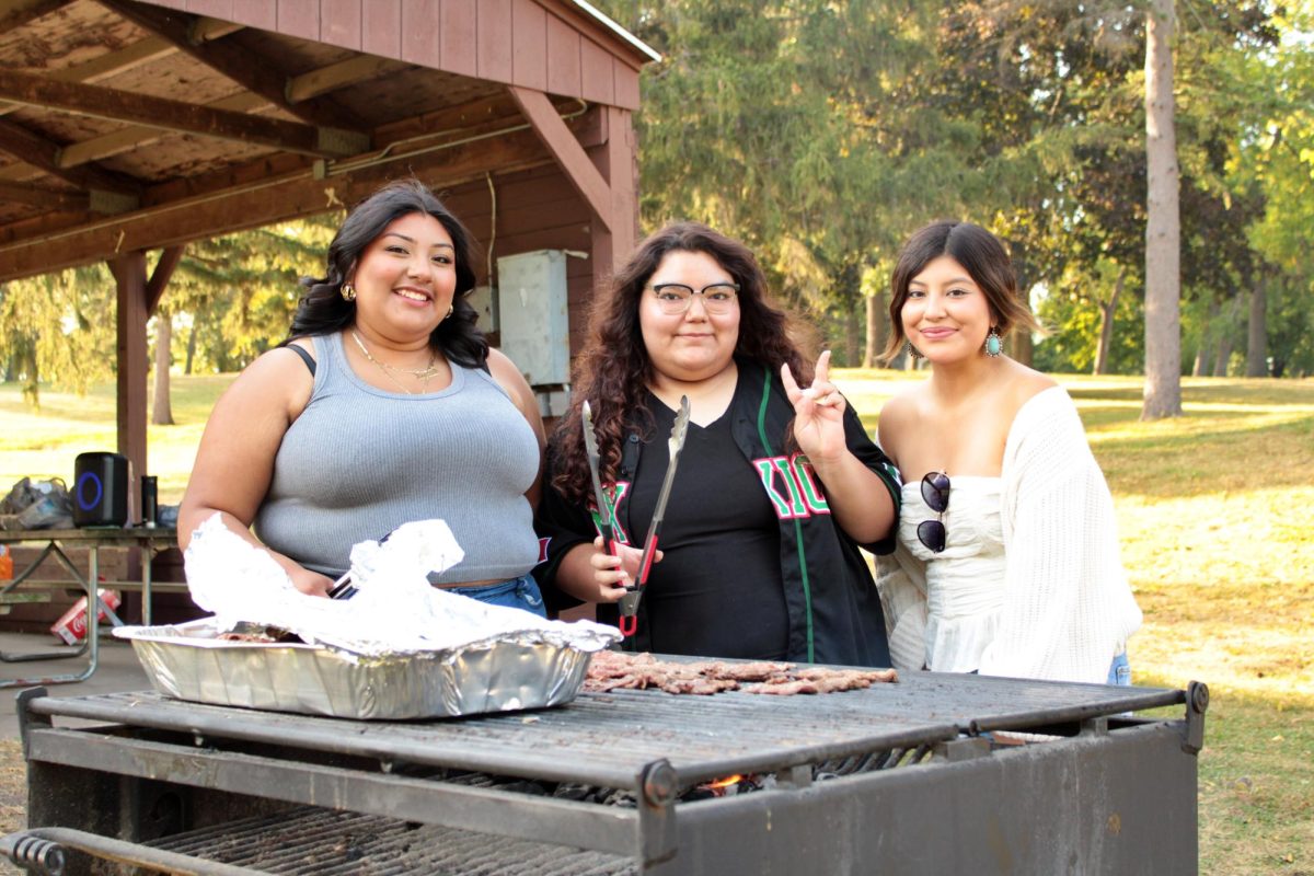  Latinos Unidos members - Stephanie Ramirez, Nataly Flores-Serna, and Vice President Dianey Sebastian helping to prepare the food for the Latinos Unidos cookout in Starin Park on Thursday, September 12, 2024