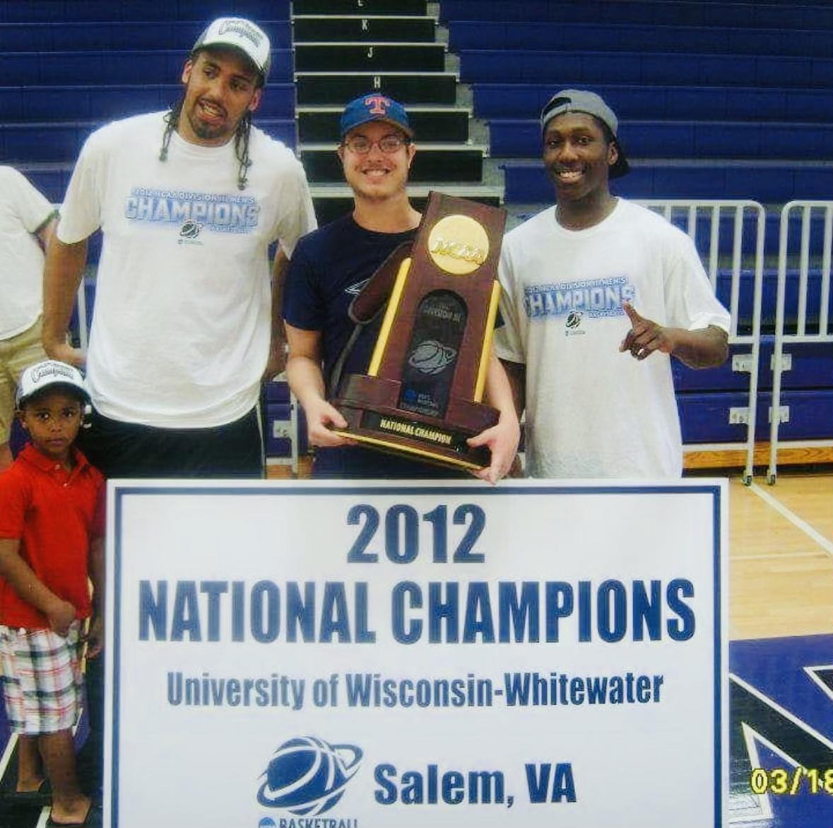 Friends, family and teammates, pictured, left to right, Chris Davis Jr., Chris Davis Sr., Daniel Schoettler and Quardell Young celebrate together after winning the 2012 national championship.
