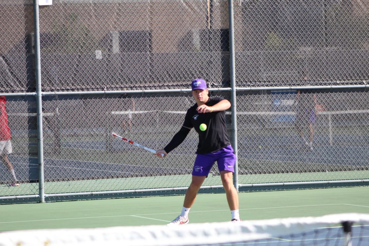 Senior Payton Adkisson lines up a forehand hit at the Warhawk Fall Invite Sept. 9, 2024. 
