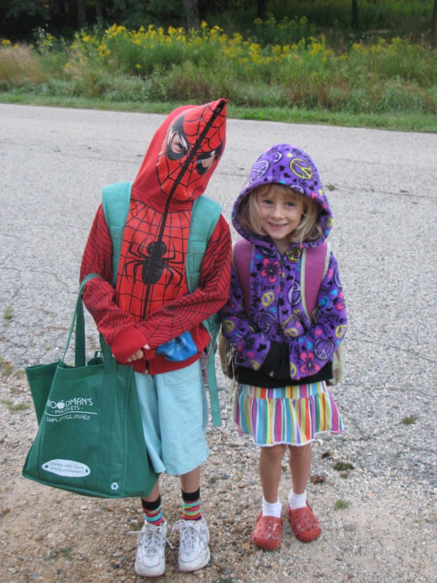 Young children posing for a first day of school photo