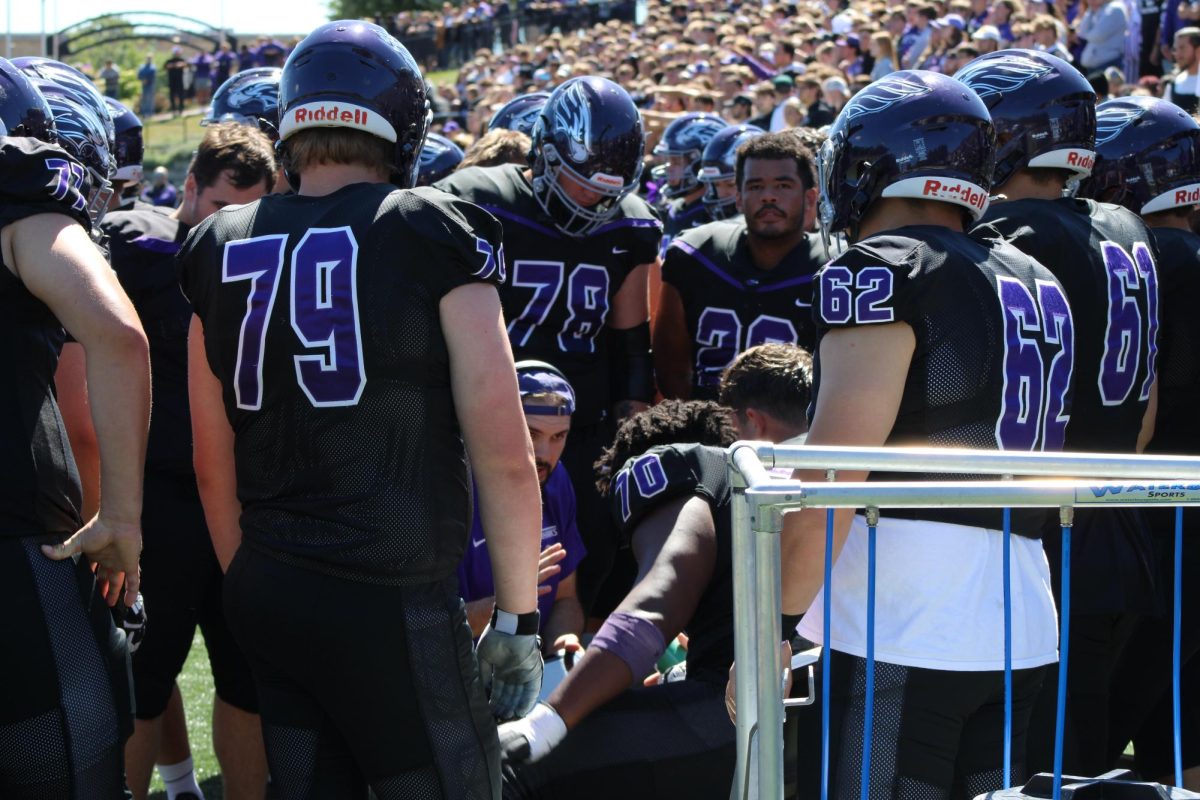 The UW-Whitewater football team uses one of 18 newly-allowed tablets to review their offense against John Carroll University Sept. 7.
