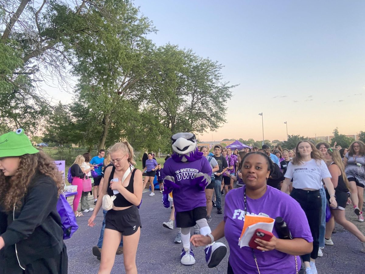 Willie Warhawk breaks out some dance moves on Warhawk Drive during Hawk Fest, Sept. 1, 2024.