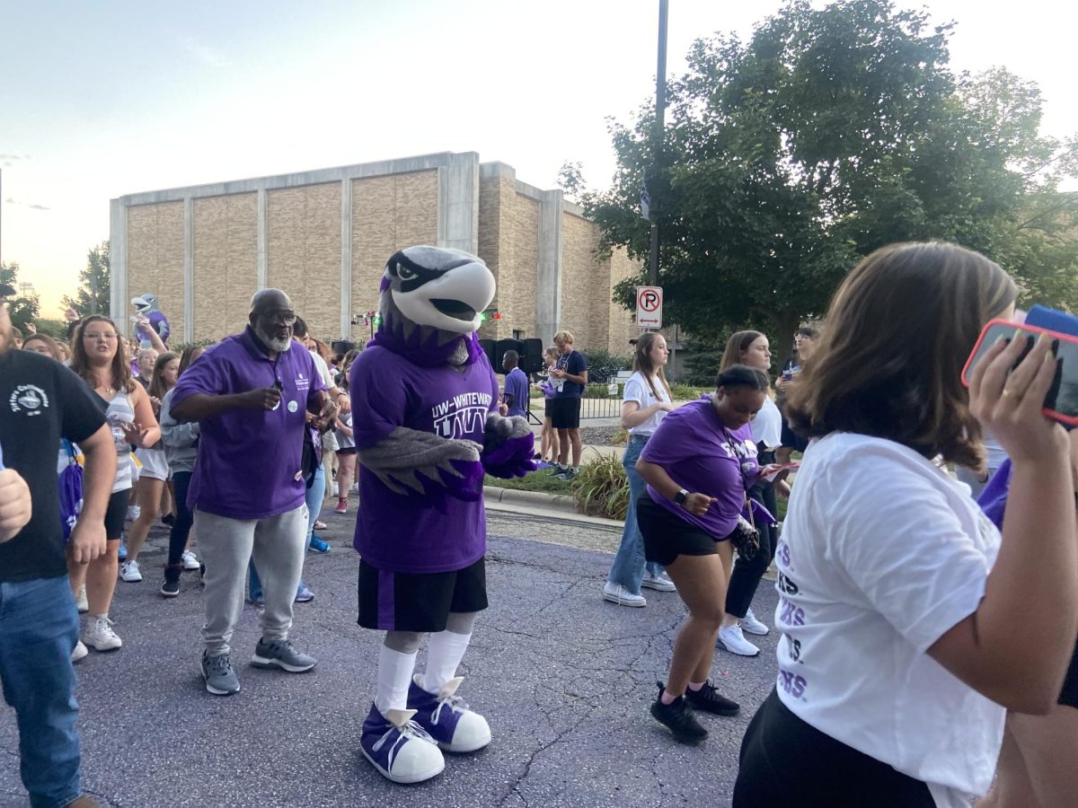 Chancellor King and Willie Warhawk dance together for the Cha Cha slide during Warhawk Welcome Week, hawk fest, Sept. 1, 2024.